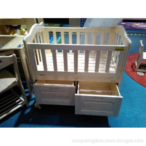 wooden baby crib with drawer